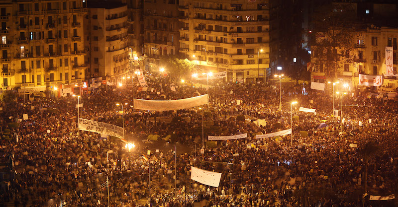 Anti-government protestors defy the curfew in Tahrir Square on February 1, 2011 in Cairo, Egypt. Photo via Getty.